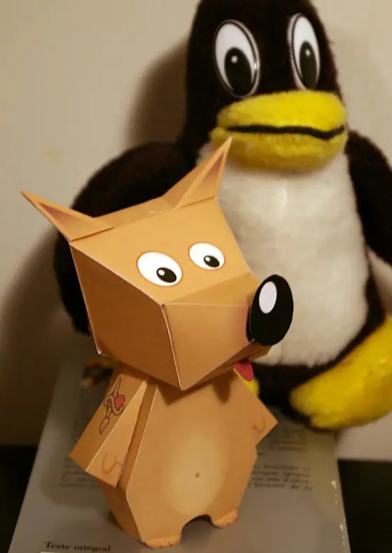 Wilber — somebody's desk, next to a Tux plush
