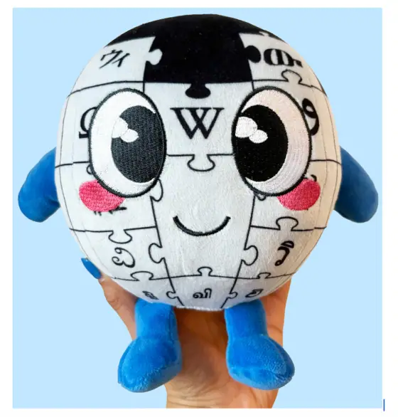 Baby Globe — Makeship plushie, in hand