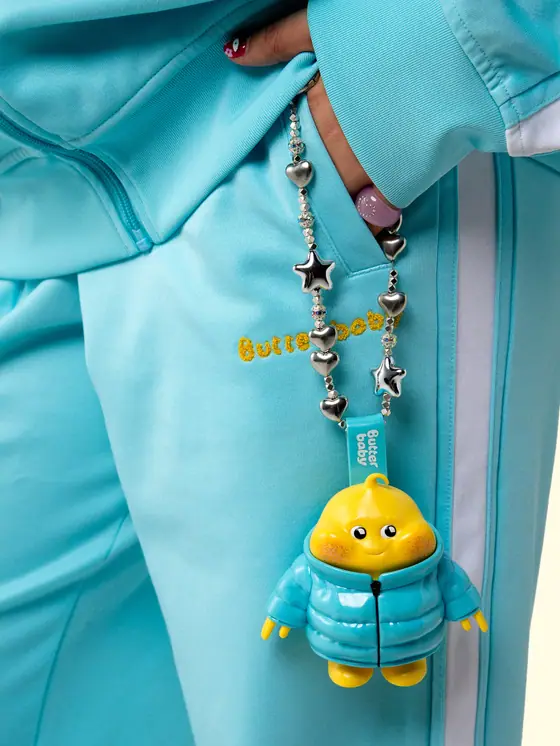 Butter Baby — Puffer-jacket charm, on a bag